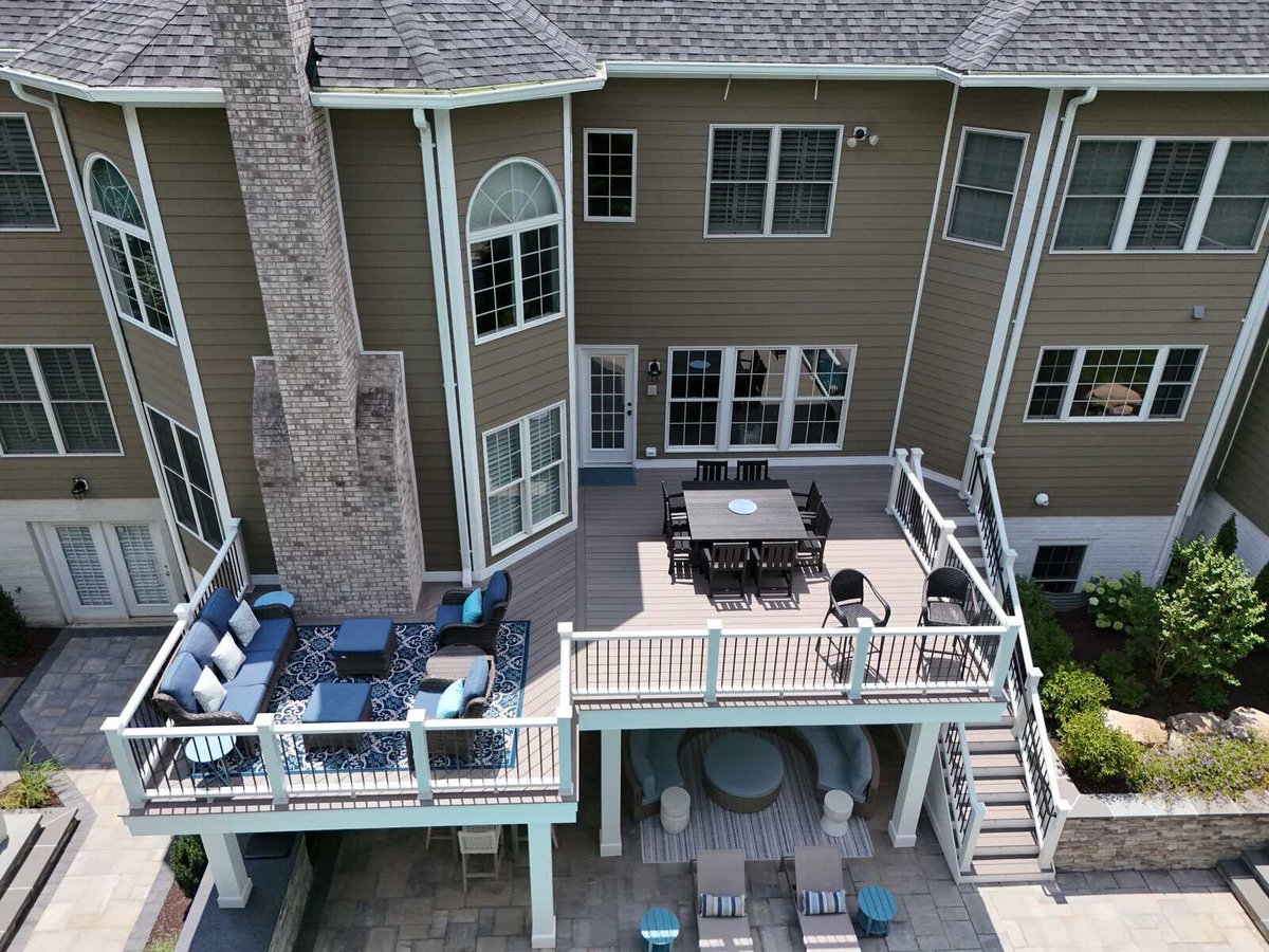 Large two-level deck with seating and dining area, designed by Deckscapes of Virginia