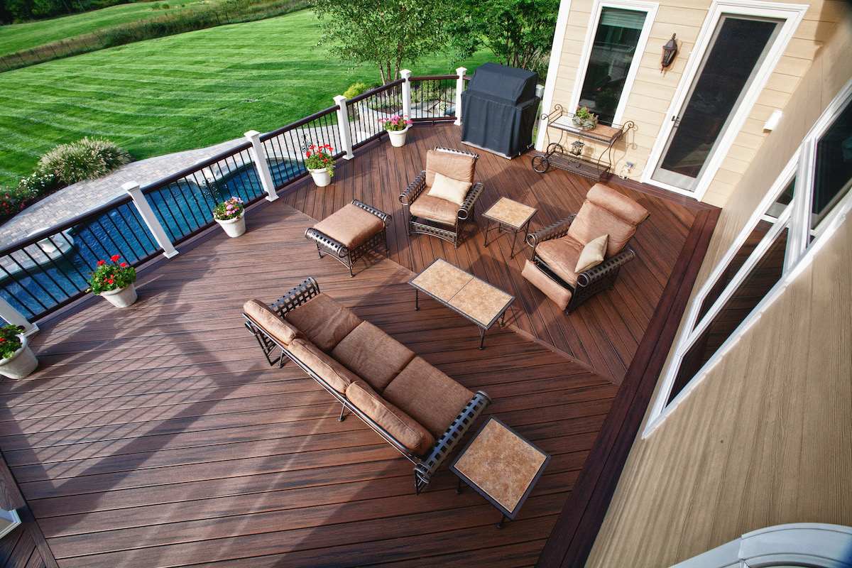 Love seat and chairs on raised composite deck by Deckscapes of VA