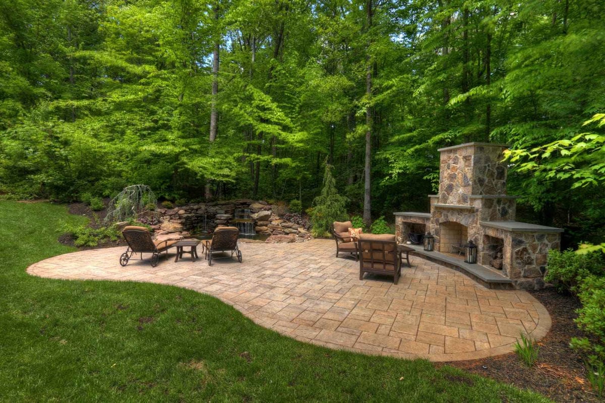 Backyard patio with custom stone fireplace